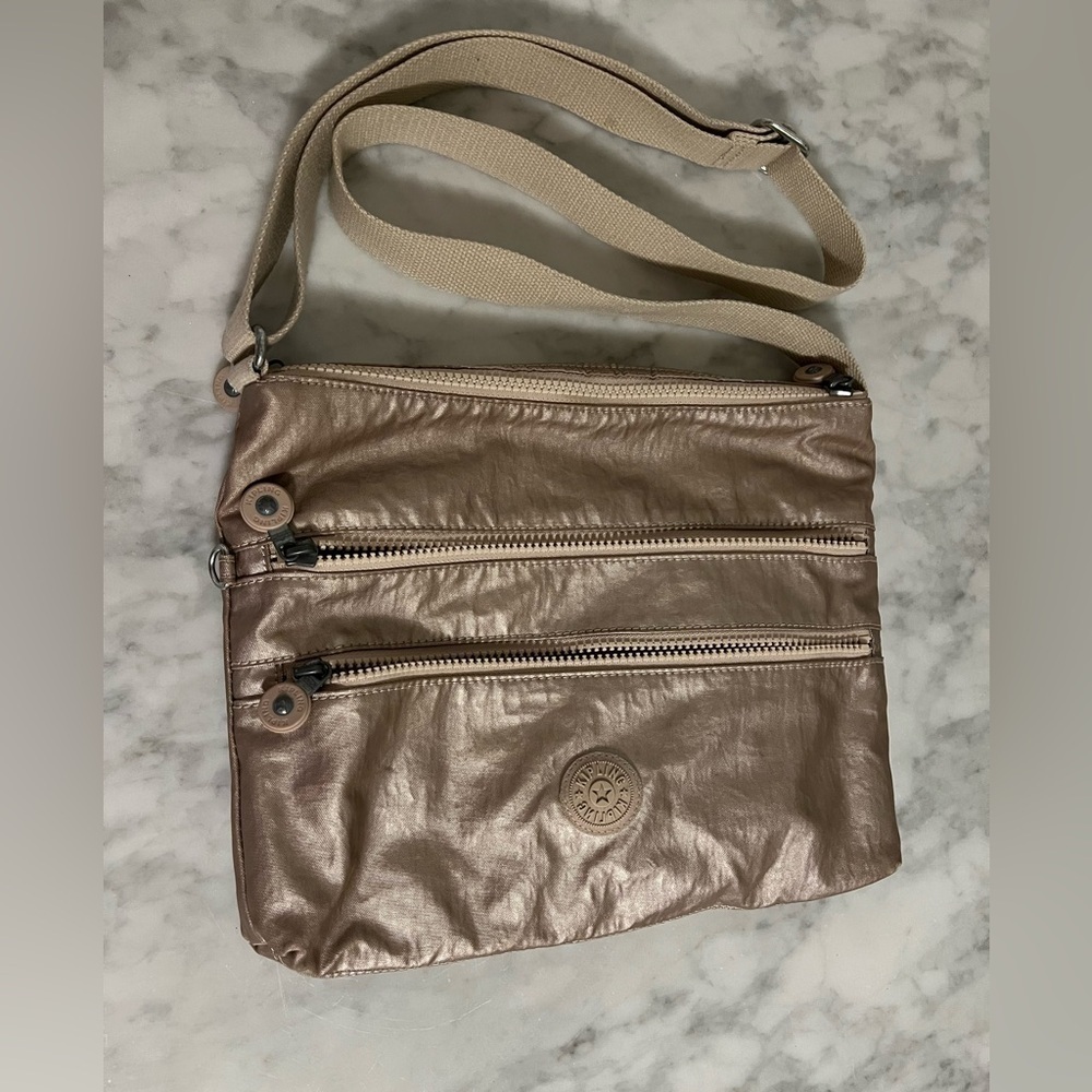Kipling metallic crossbody bag. Full length 52” strap, shortest adjustment 27”